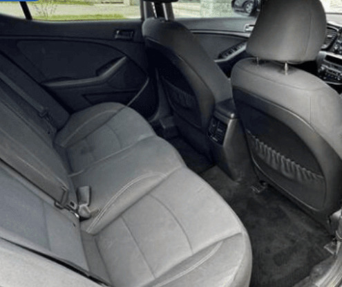 Same back seat after detailing — vacuumed, wiped down and spotless