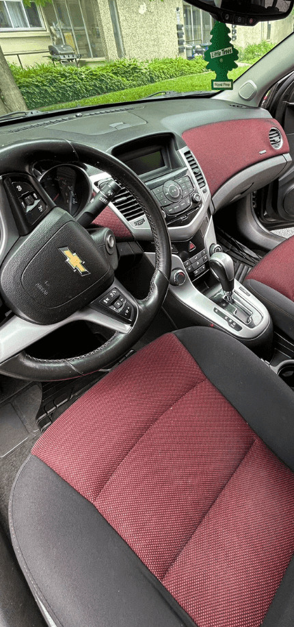 Freshly detailed Chevrolet interior — clean dash, seats and carpets